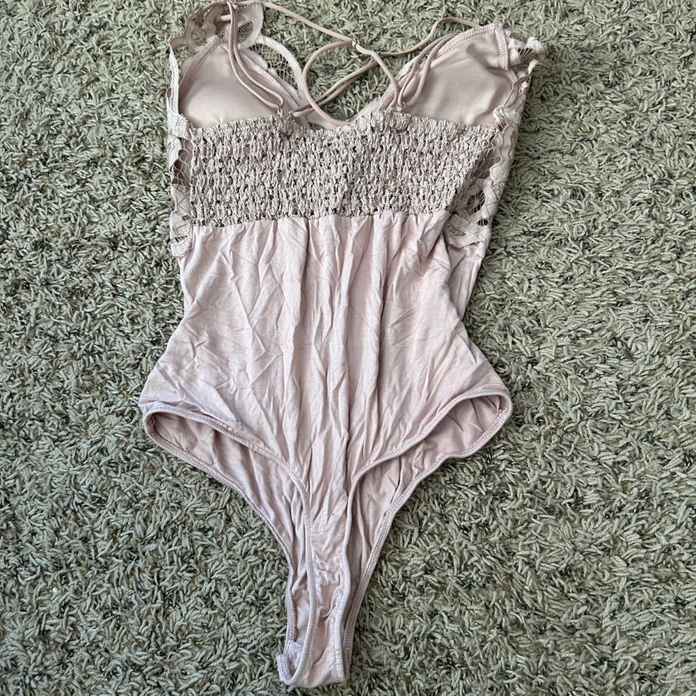 Pink body suit